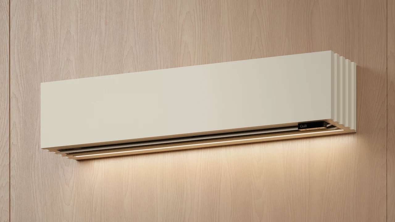 Close-up of the Quilt indoor air handler, its sculpted cover and integrated accent lighting — official Quilt product imagery