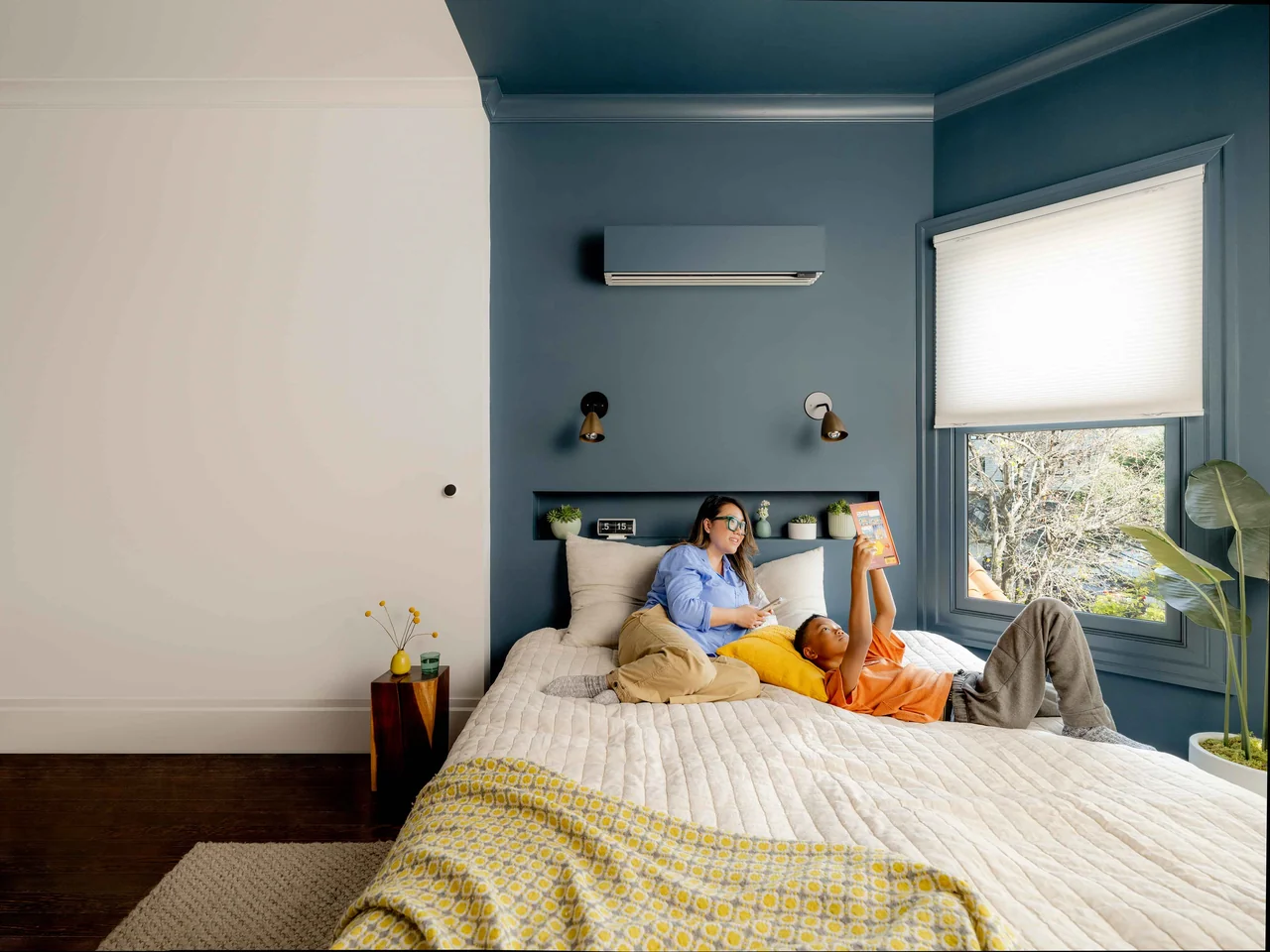 Quilt indoor unit with a painted cover in a bedroom