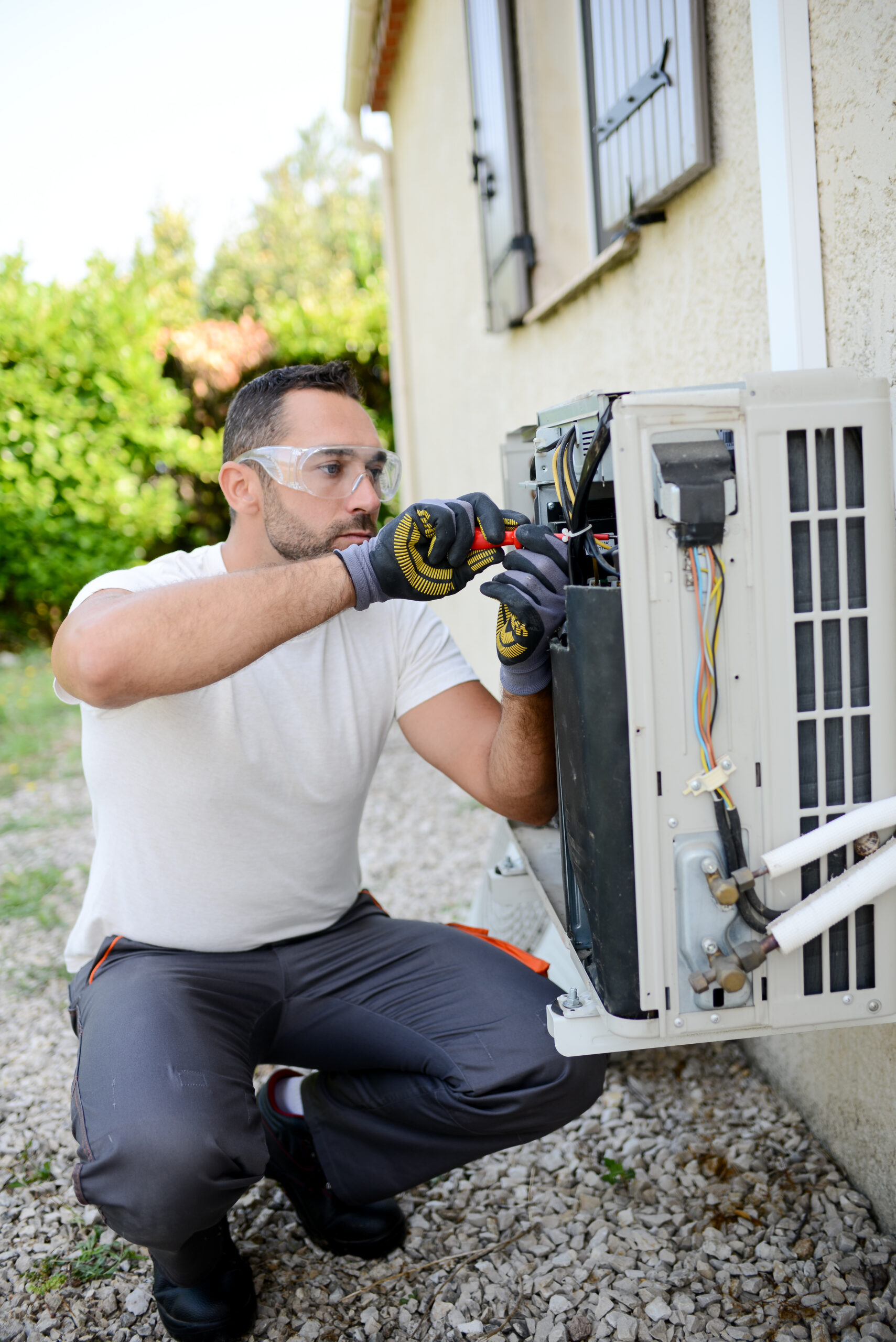 FREEDOM HVAC technicians inspecting a heat pump system at a home near Joplin, Missouri.